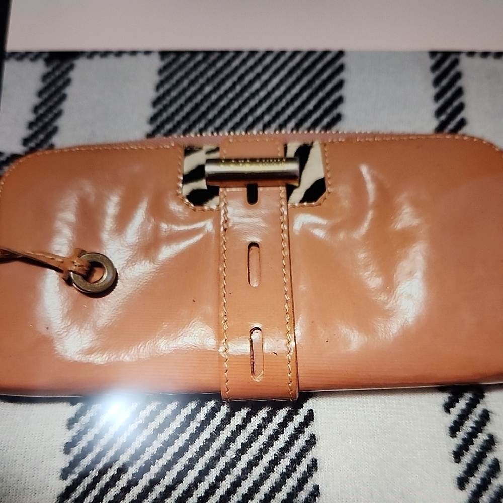 Jimmy Choo tan pink patent leather wallet.